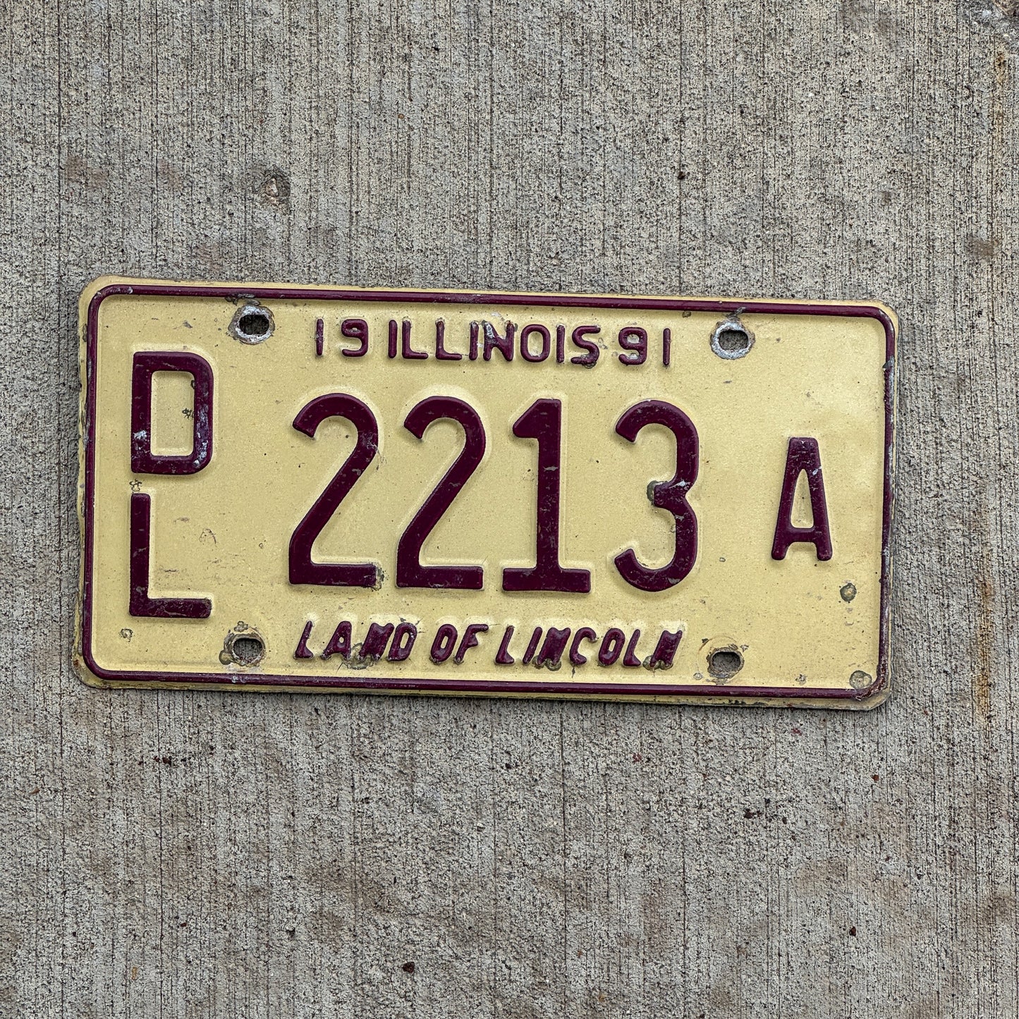 Photo of a 1991 Illinois Dealer License Plate Auto Tag 1 Vintage Garage 2213 A with original patina