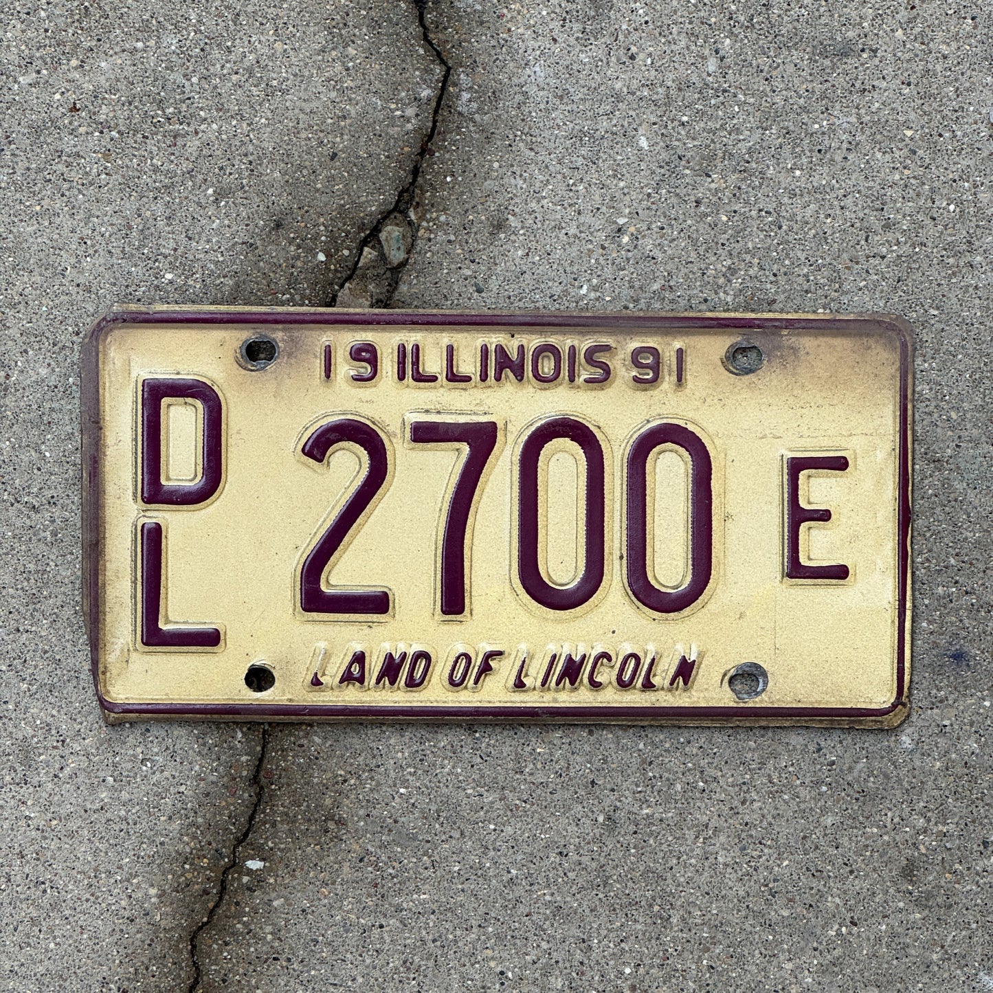 Photo of a 1991 Illinois Dealer License Plate Auto Tag Garage Decor Vintage 2700 E with original patina
