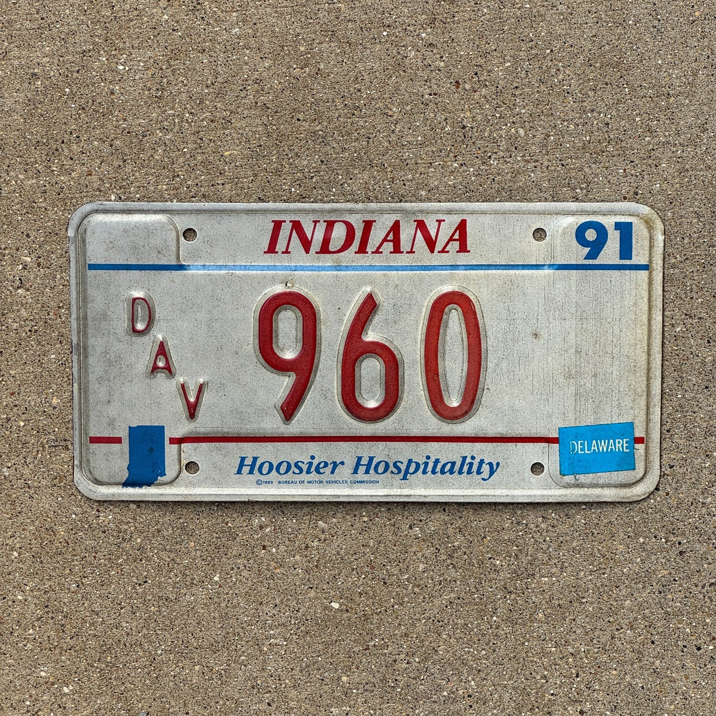 Photo of a 1991 Indiana Disabled Veteran License Plate Auto Tag Garage Decor Vintage DAV 960