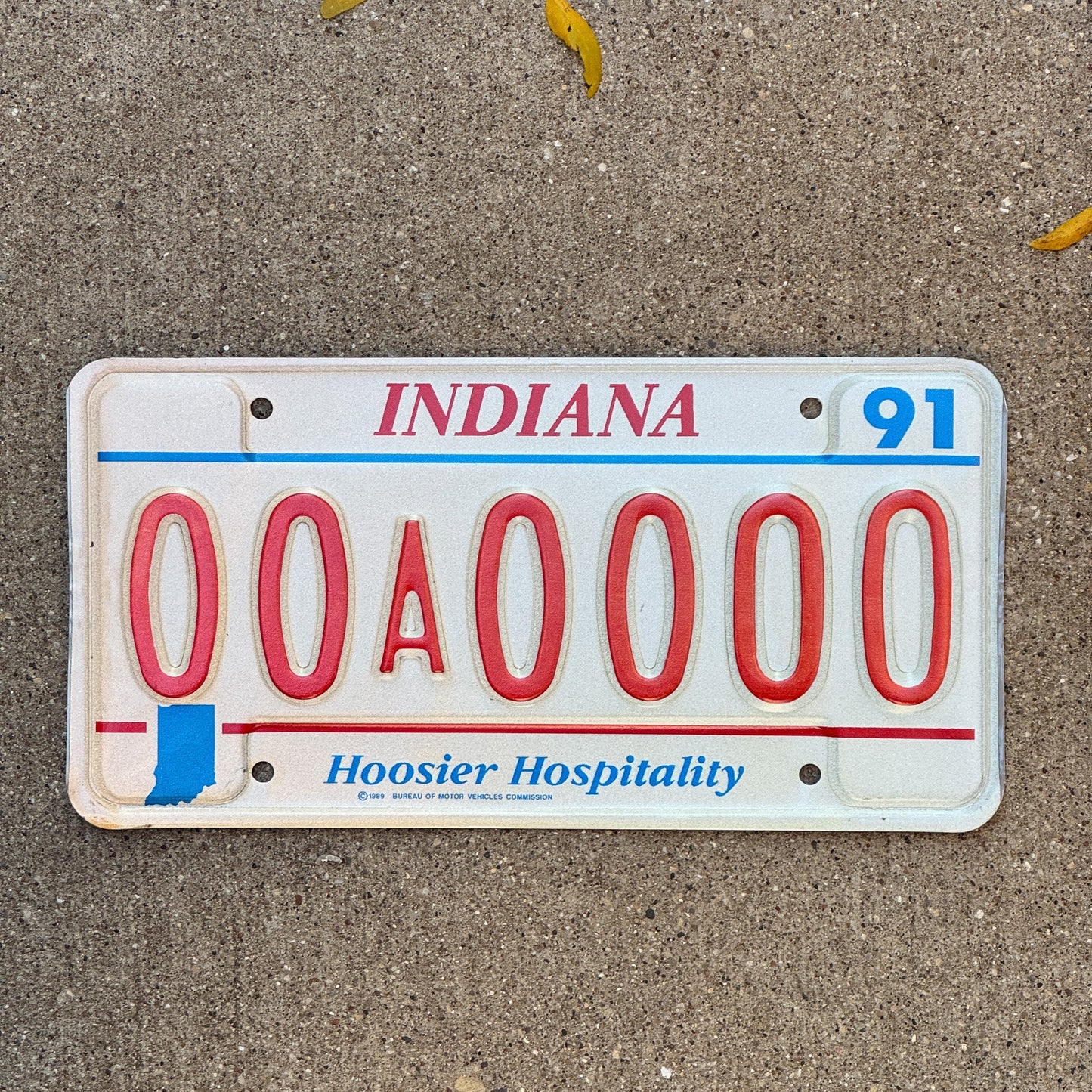 Photo of a 1991 Indiana Sample License Plate Auto Tag 1 Garage Decor 00A0000 with original patina