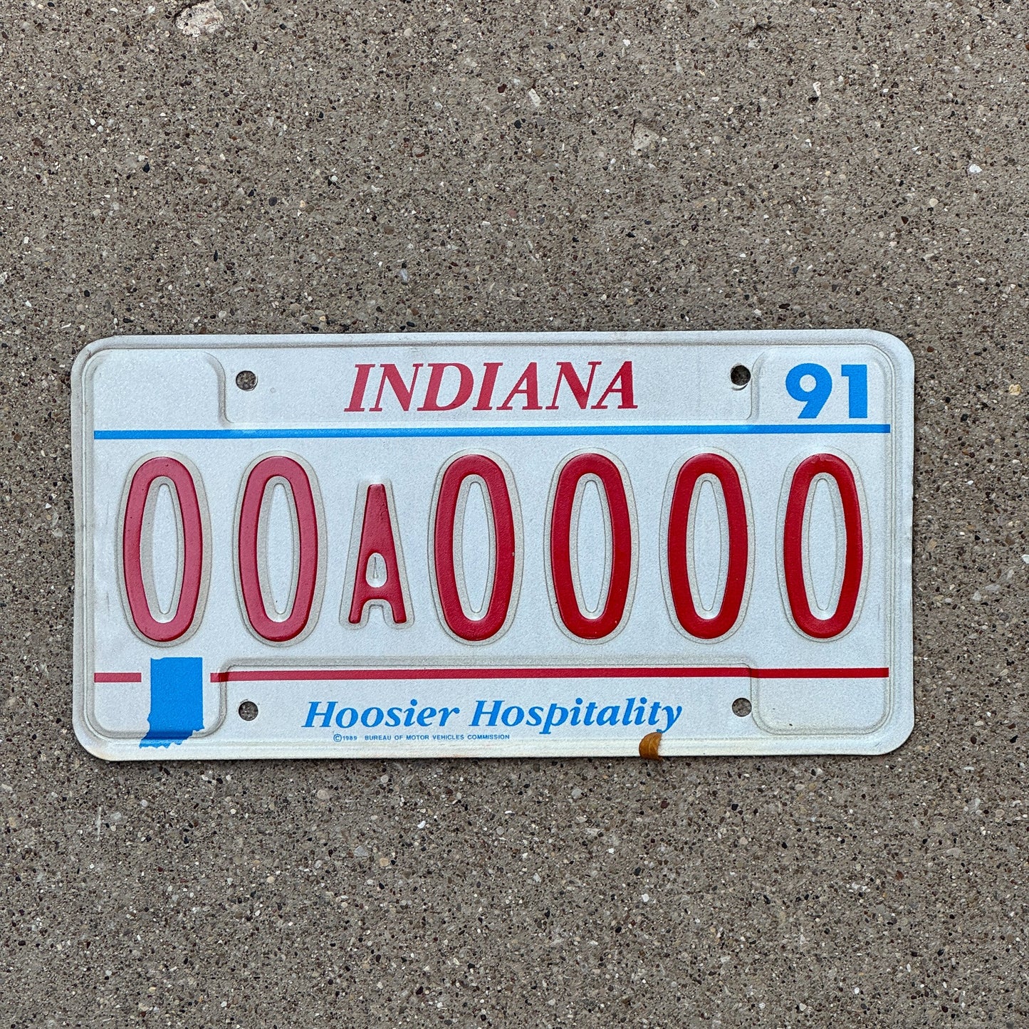 Photo of a 1991 Indiana Sample License Plate Auto Tag 2 Garage Decor 00A0000 with original patina