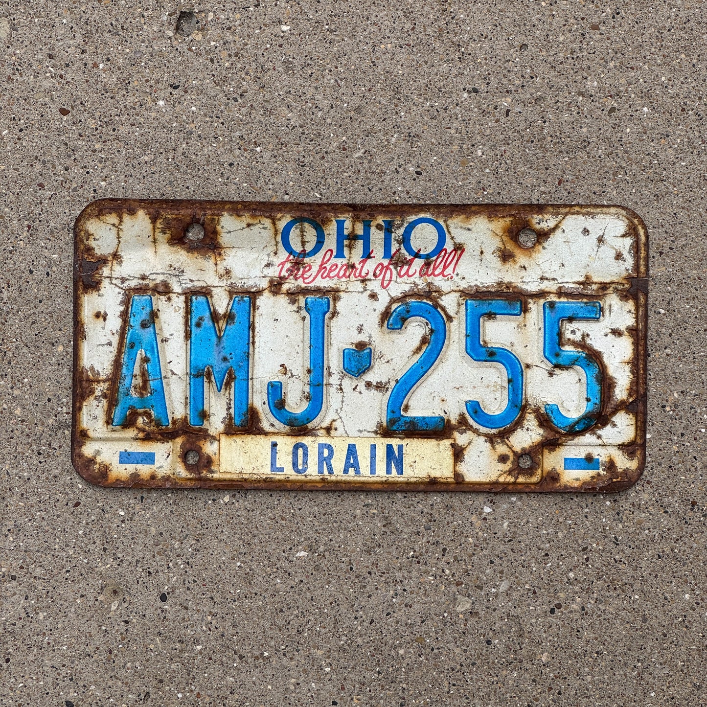 Photo of a 1991 Ohio License Plate Auto Tag 1 Vintage Garage AMJ 255 with original patina