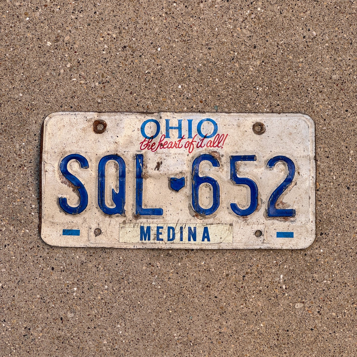 Photo of a 1991 Ohio License Plate Auto Tag 2 Vintage Garage SQL 652 with original patina