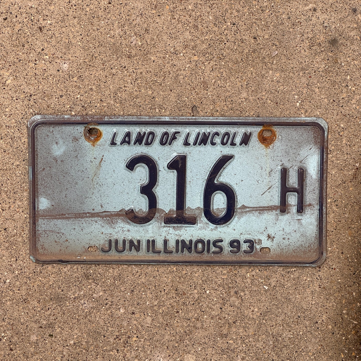 Photo of a 1992 1993 Illinois Truck License Plate Auto Tag 1 Vintage Garage 316 H with original patina