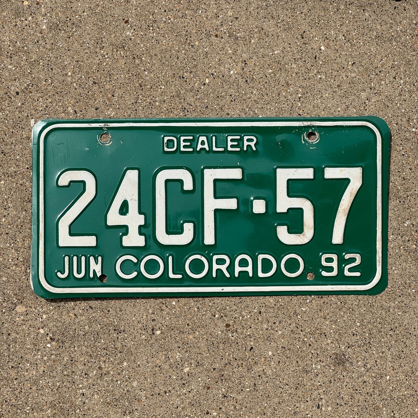 Photo of a 1992 Colorado Dealer License Plate Auto Tag Garage Decor Vintage 24 CF 57