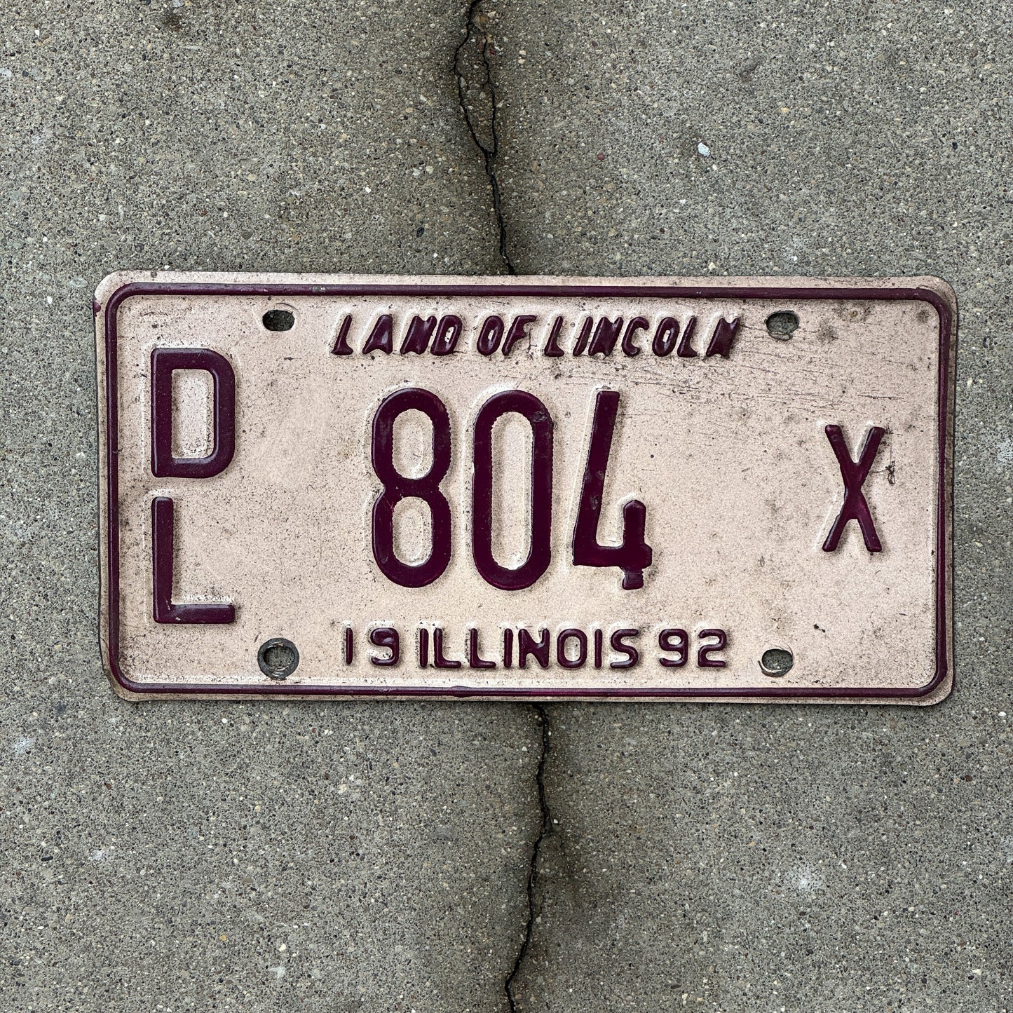 Photo of a 1992 Illinois Dealer License Plate Auto Tag 1 Vintage Garage 804 X with original patina