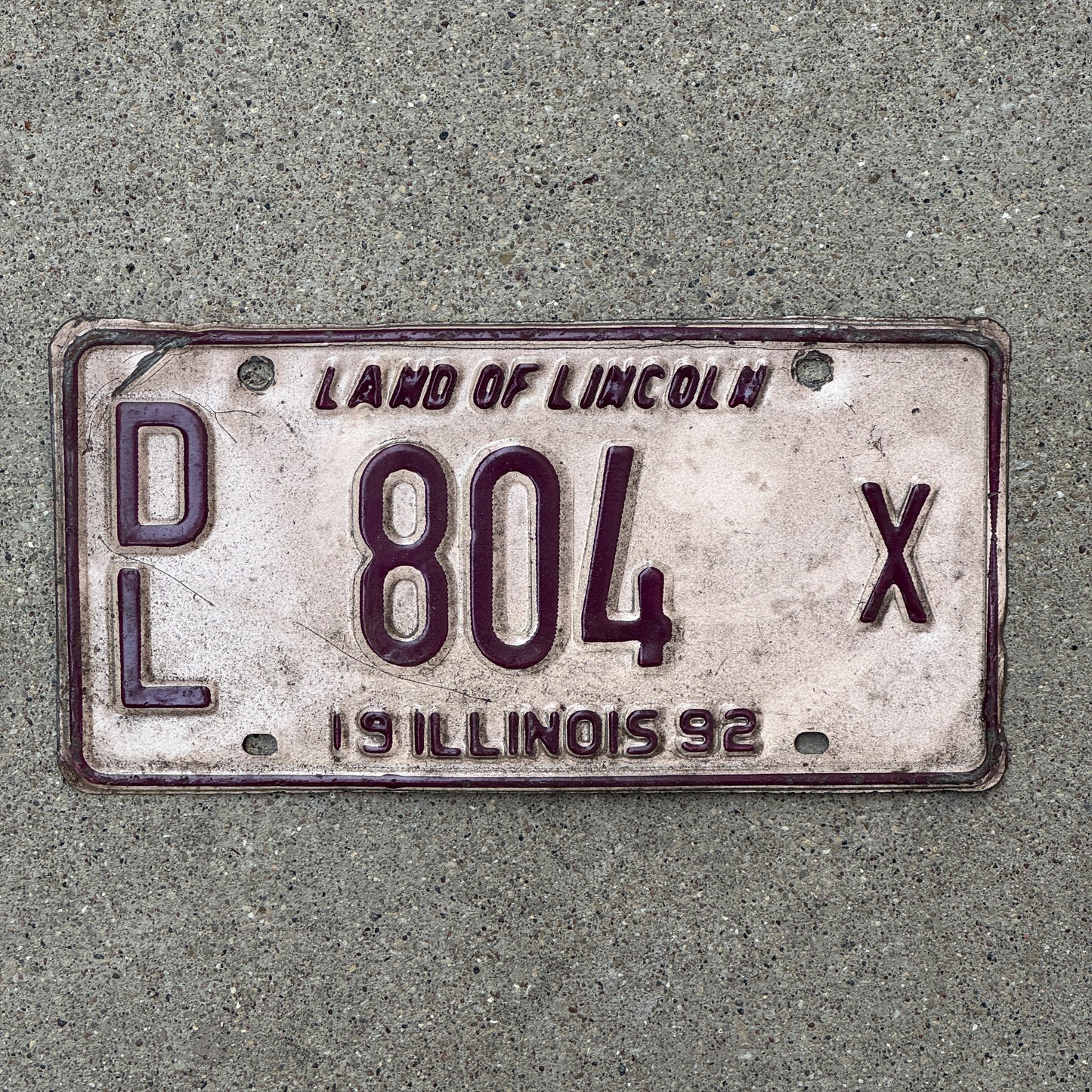 Photo of a 1992 Illinois Dealer License Plate Auto Tag 2 Vintage Garage 804 X with original patina