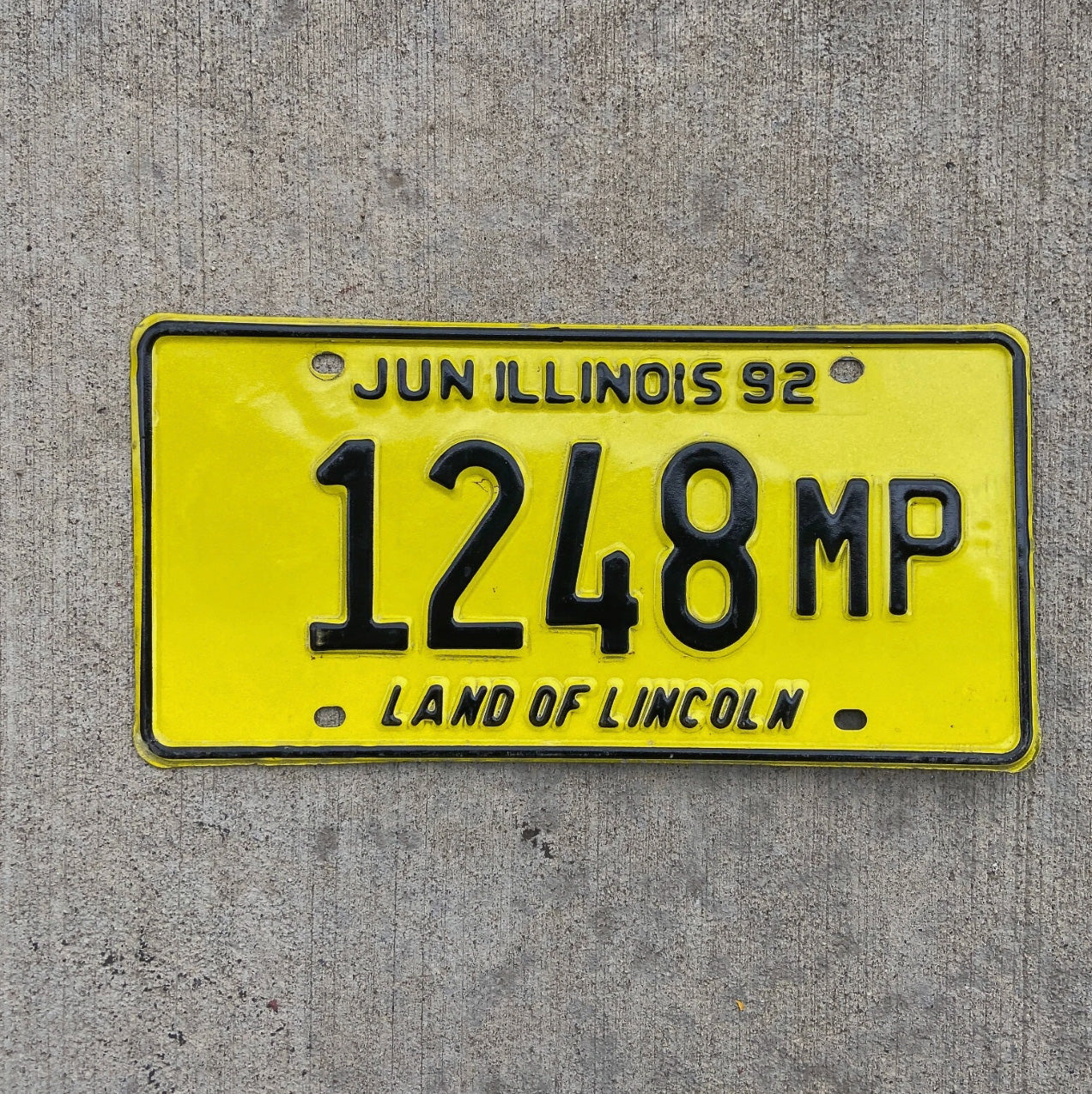 Photo of a 1992 Illinois Truck Mileage Tax License Plate Auto Tag Garage Decor Vintage 1248 MP with original patina