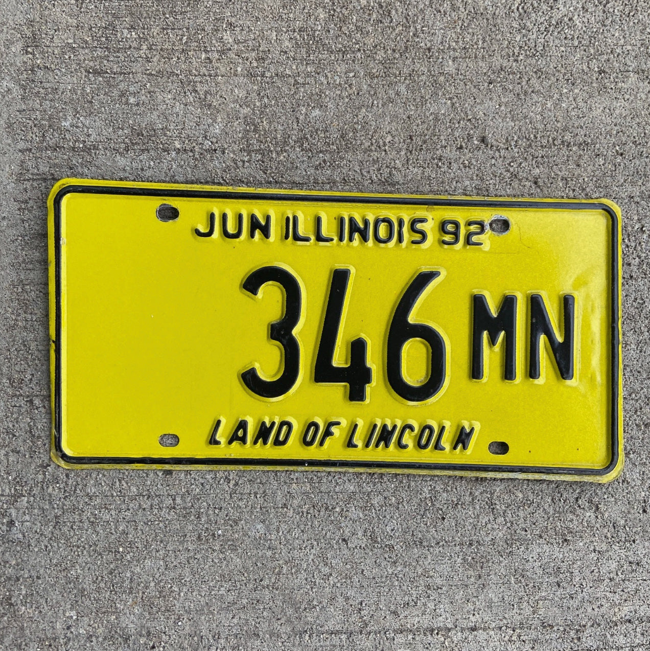 Photo of a 1992 Illinois Truck Mileage Tax License Plate Auto Tag Garage Decor Vintage 346 MN with original patina