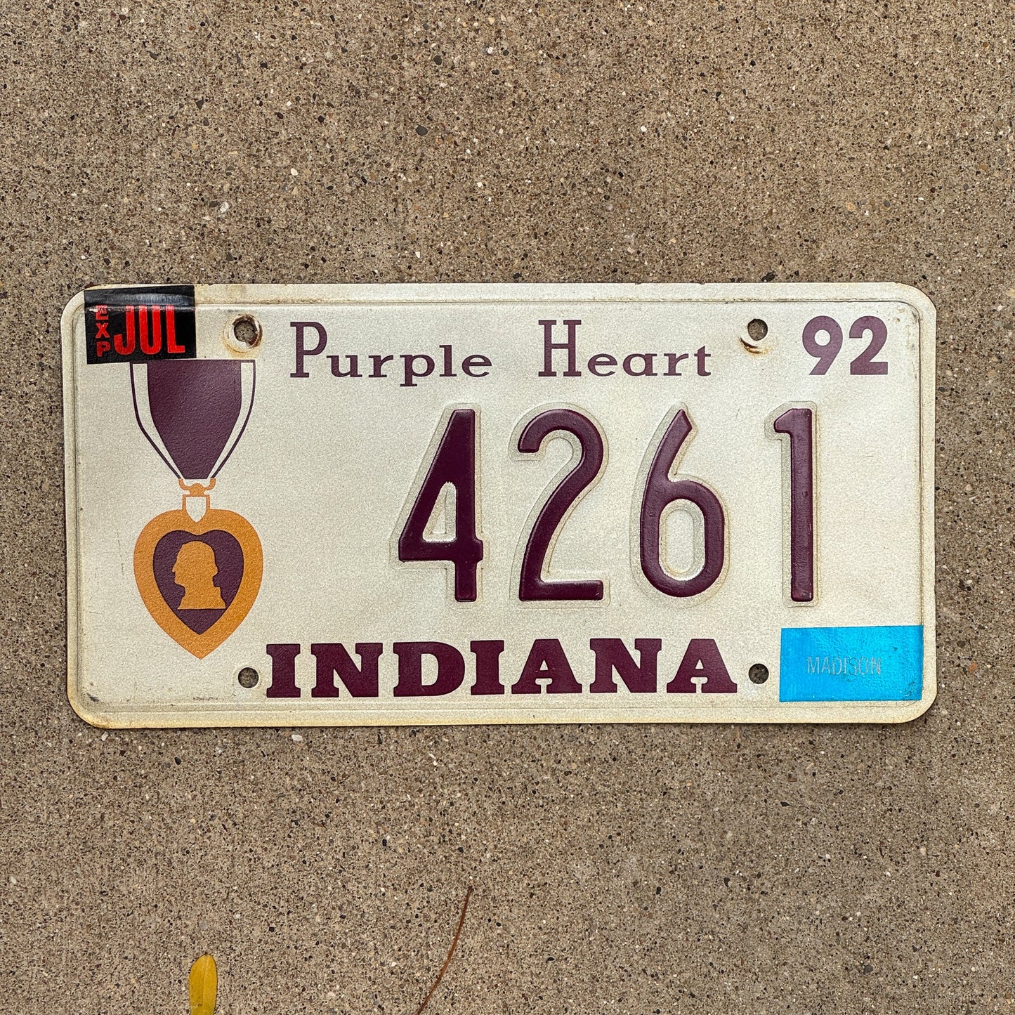 Photo of a 1992 Indiana Military License Plate Auto Tag Garage Decor Vintage Purple Heart 4261 with original patina