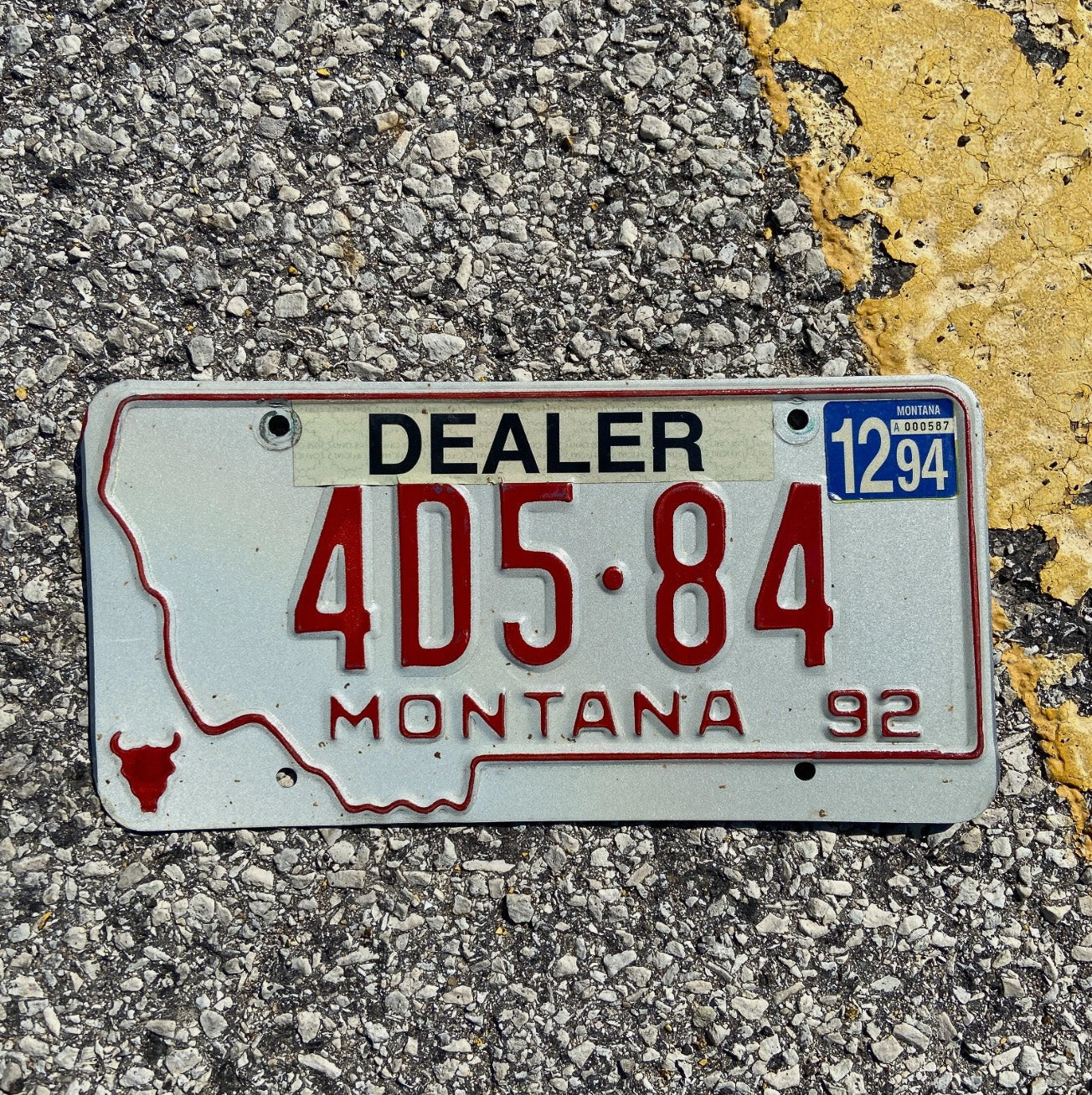 Photo of a 1992 Montana Dealer License Plate Auto Tag Garage Decor Vintage 4D 584