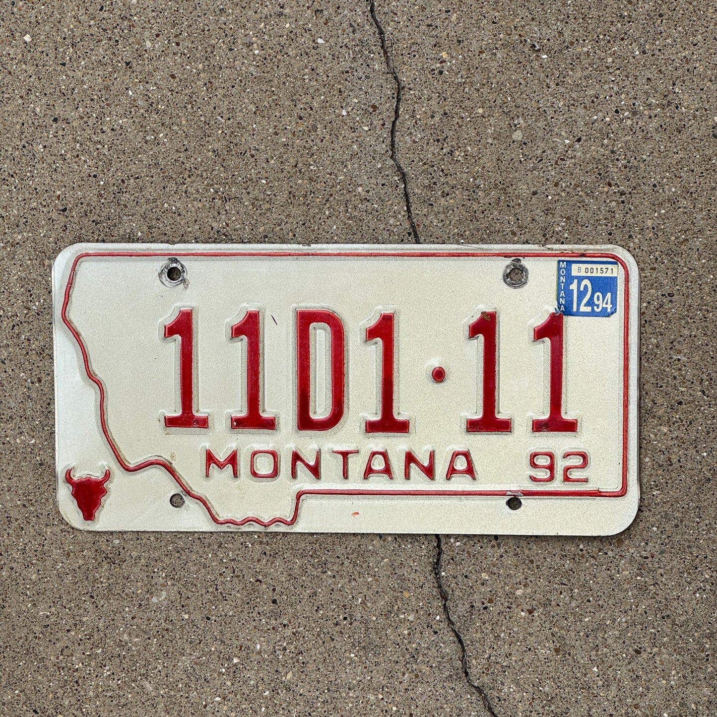 Photo of a 1992 Montana Dealer License Plate Auto Tag Garage Decor Vintage Repeat Repeating 11 D 111
