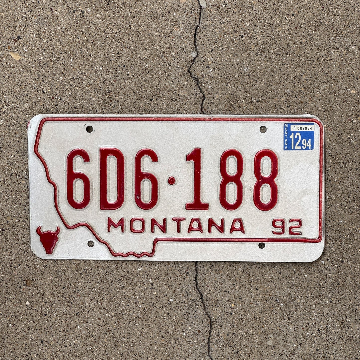 Photo of a 1992 Montana Dealer License Plate Auto Tag Garage Decor Vintage State Shape 6D6 188