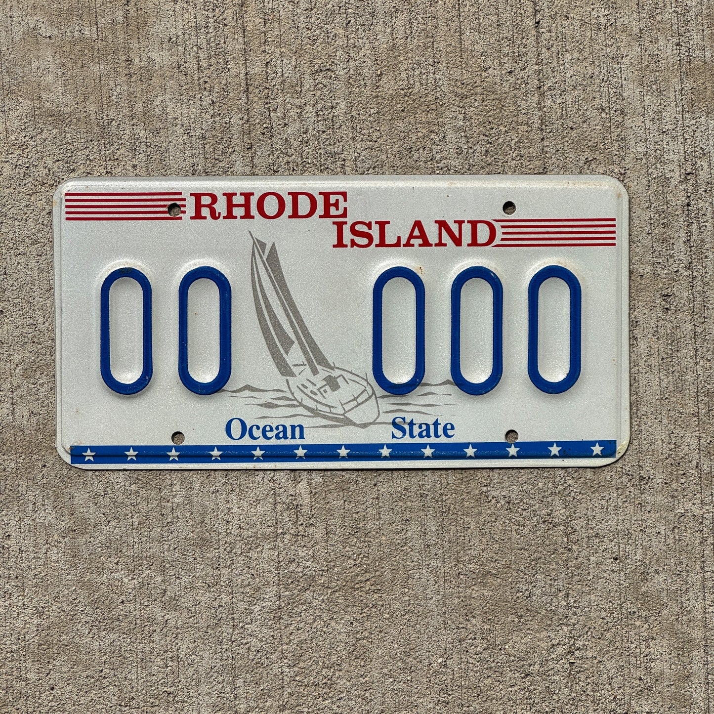 Photo of a 1992 Rhode Island Graphic Sample License Plate Auto Tag Garage Decor Vintage Designor Sailboat Base 00 000