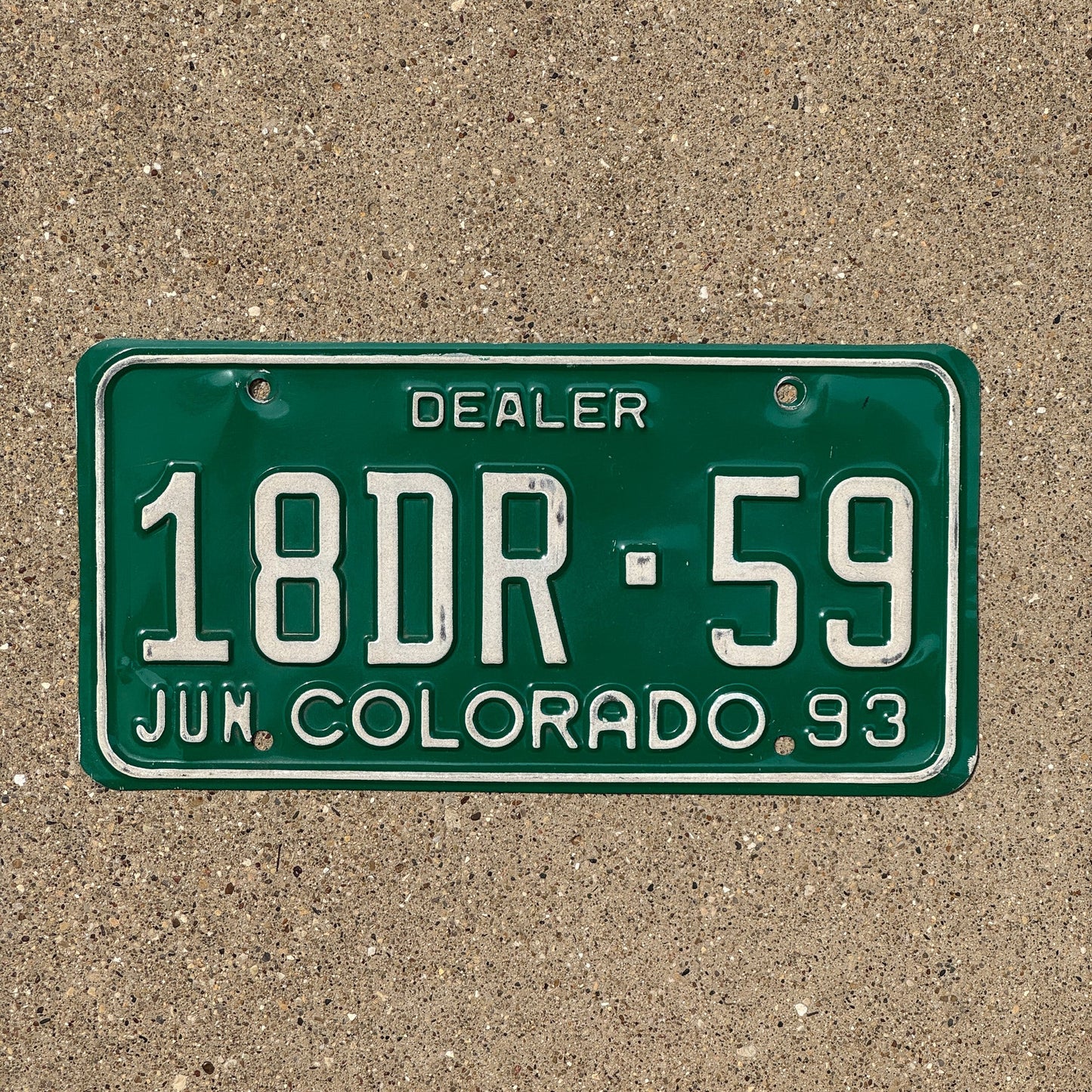 Photo of a 1993 Colorado Dealer License Plate Auto Tag Garage Decor Vintage 18 DR 59