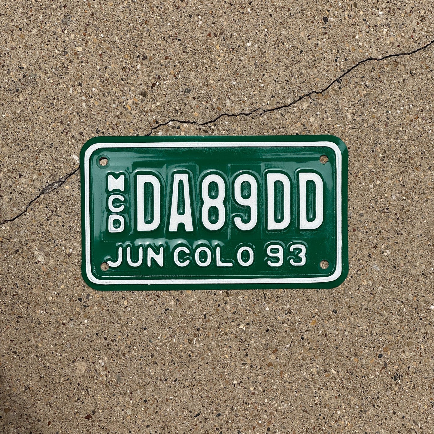 Photo of a 1993 Colorado Motorcycle Dealer License Plate Auto Tag Garage Decor Vintage DA 89 DD
