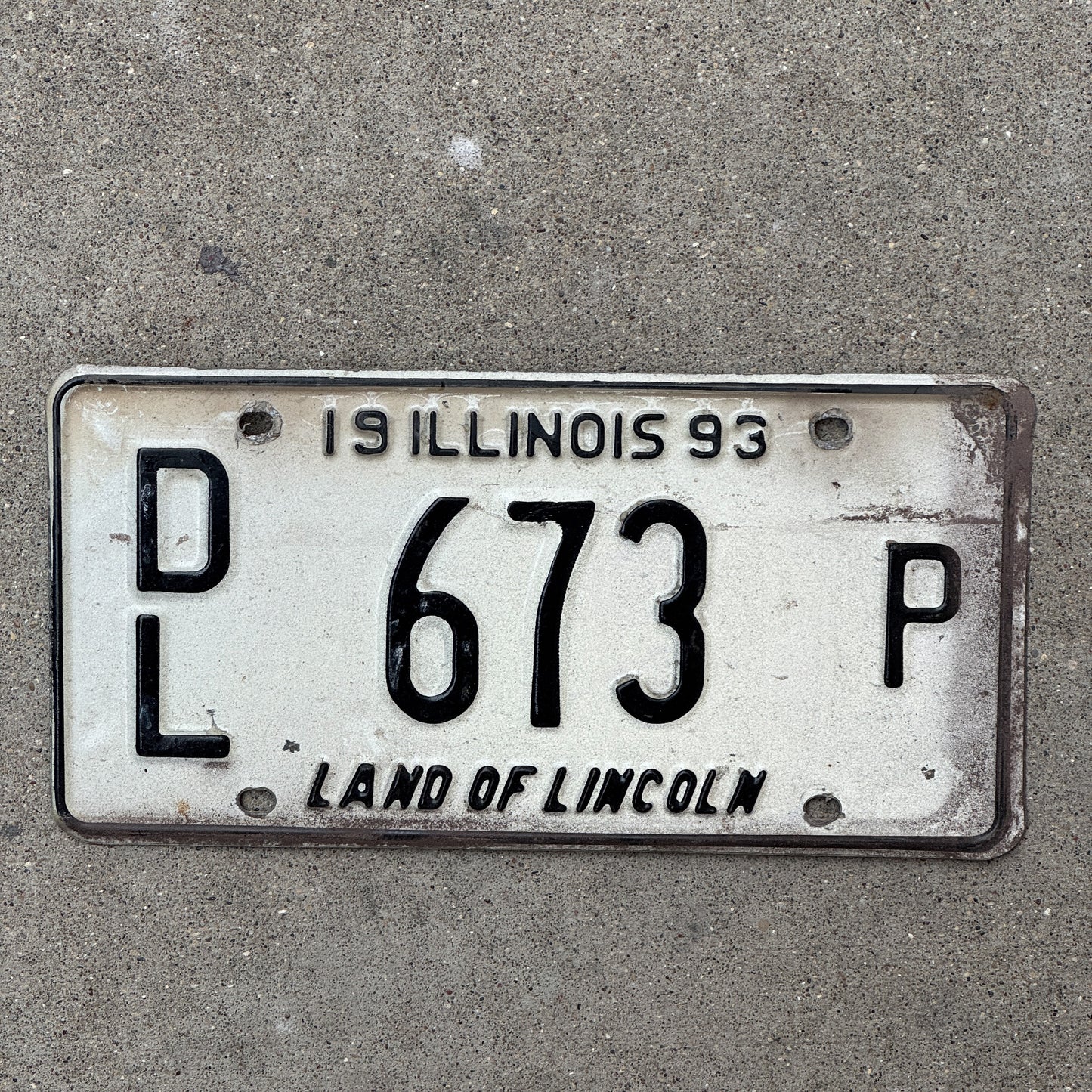 Photo of a 1993 Illinois Dealer License Plate Auto Tag 2 Vintage Garage Merritt's Sterling Ford Mercury Lincoln Dealer 673 P with original patina