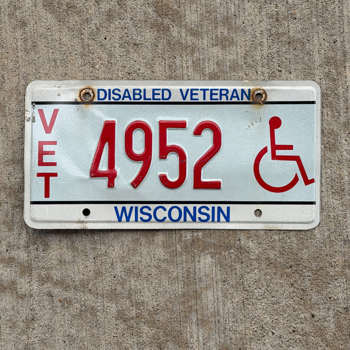 Photo of a 1993 Wisconsin Disabled Veteran License Plate Auto Tag Garage Decor Vintage 4952 with original patina