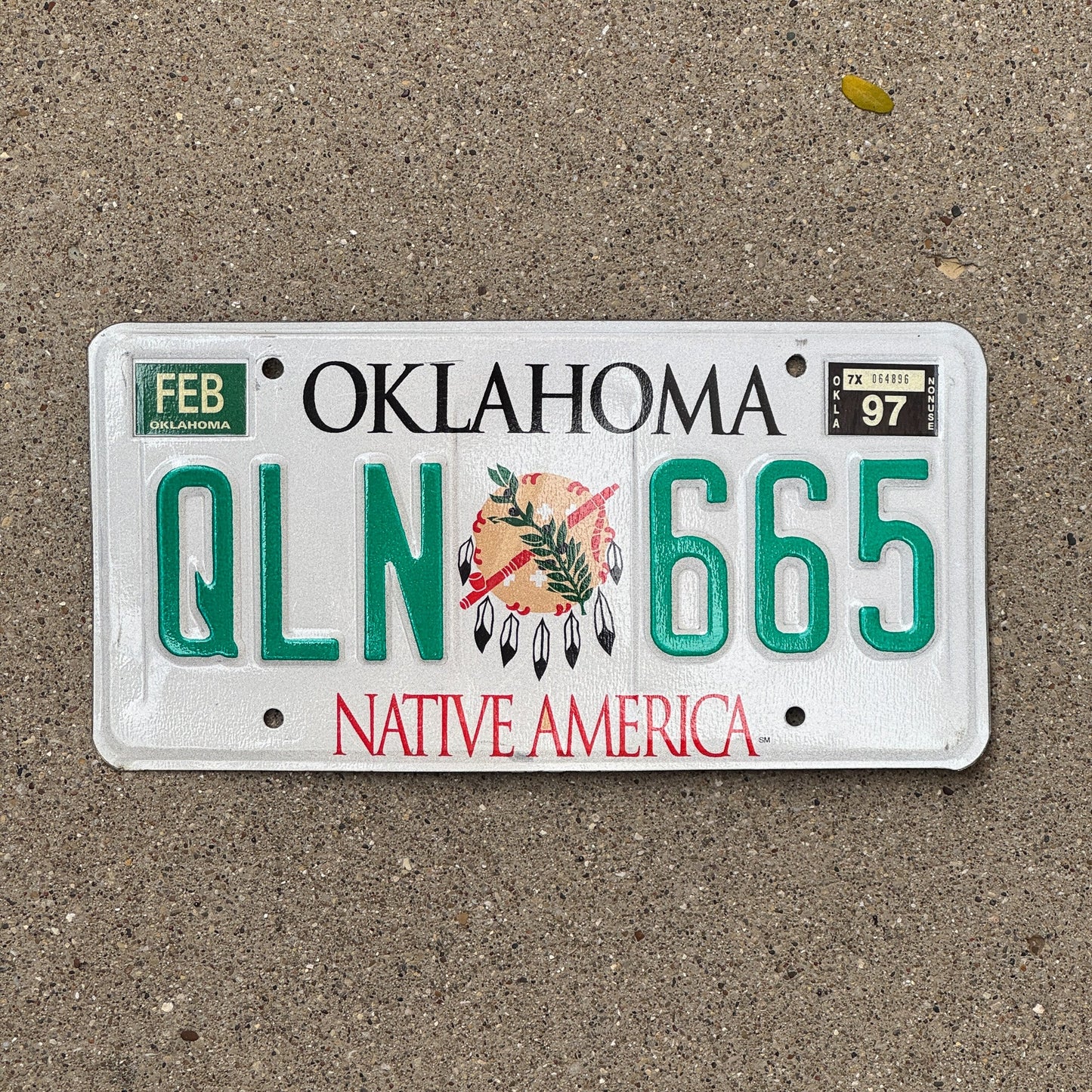 Photo of a 1994 1997 Oklahoma License Plate Auto Tag Garage Decor Vintage Native America QLN 665 with original patina
