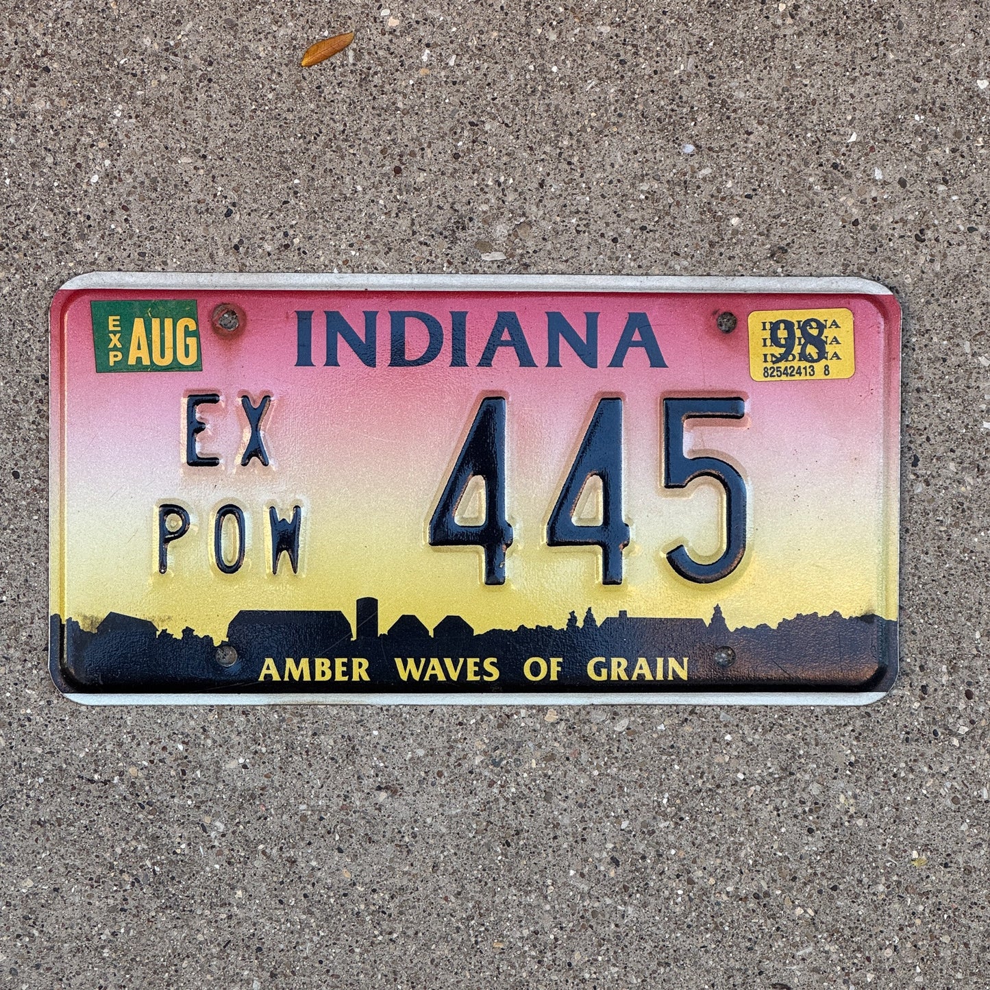 Photo of a 1994 1998 Indiana Ex Prisoner of War License Plate Auto Tag Garage Decor Vintage POW 445 with original patina