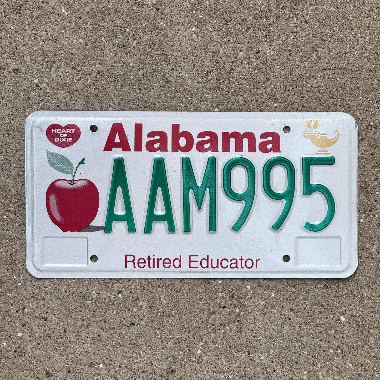 Photo of a 1994 Alabama Retired Educator License Plate Auto Tag Garage Decor Vintage Apple Teacher AAM 995