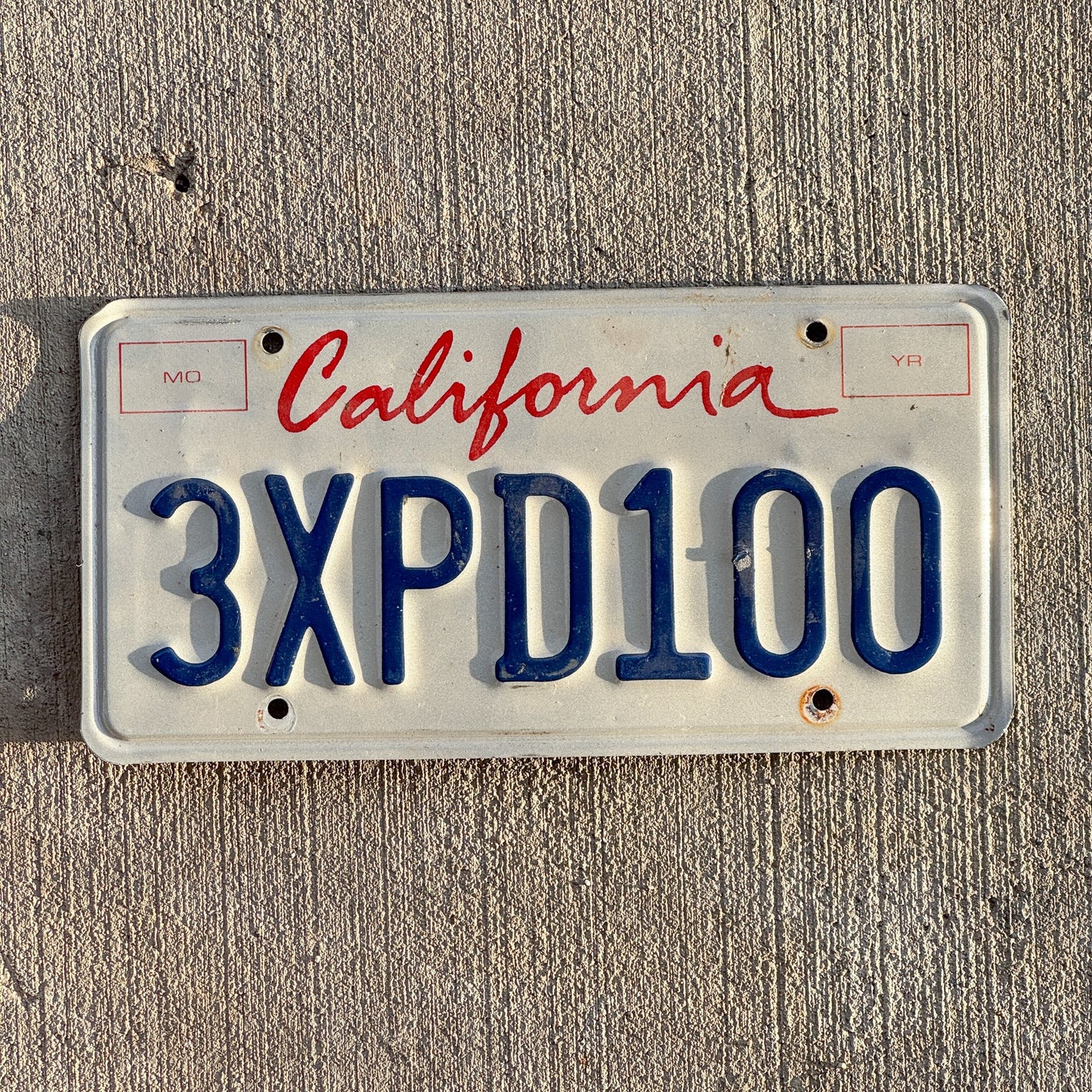 Photo of a 1994 California License Plate Auto Tag 2 Garage Decor 3 XPD 100