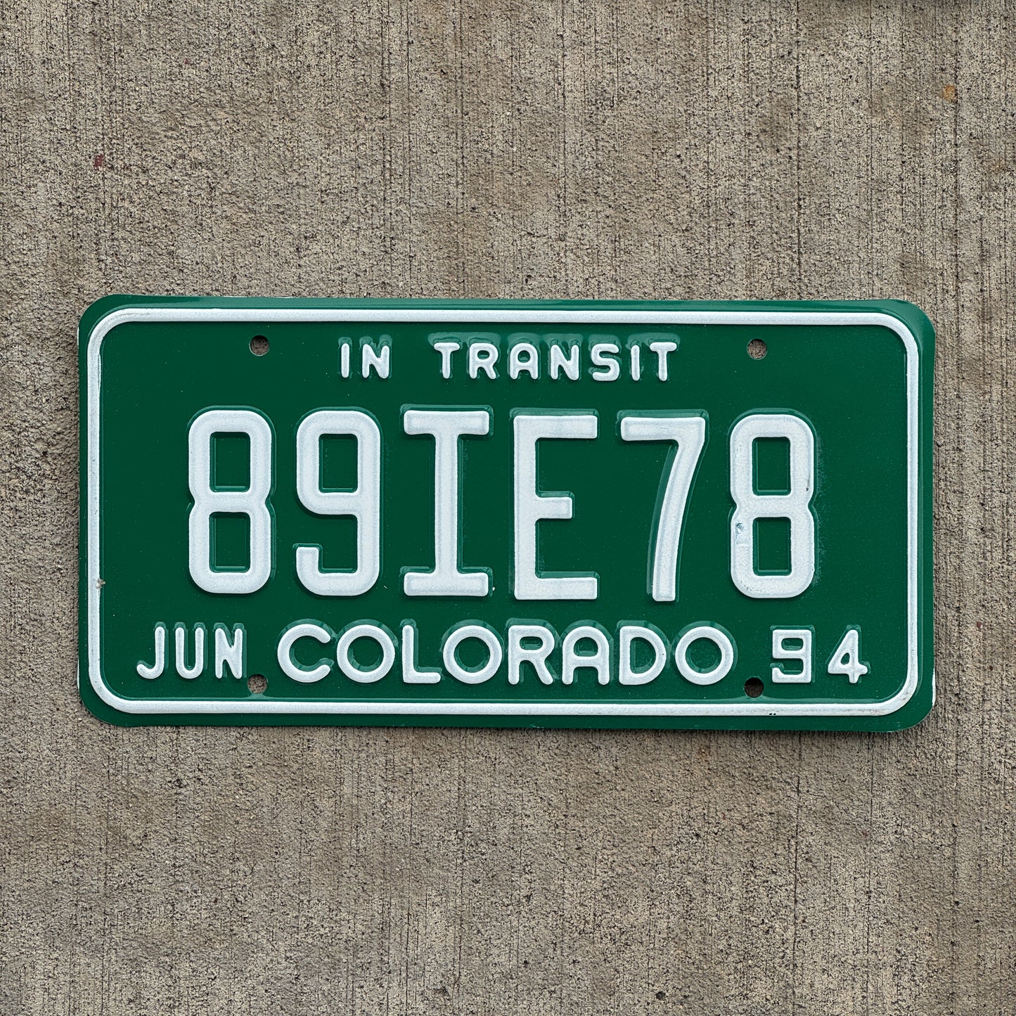 Photo of a 1994 Colorado In Transit Dealer License Plate Auto Tag Garage Decor Vintage 89 IE 78 with original patina