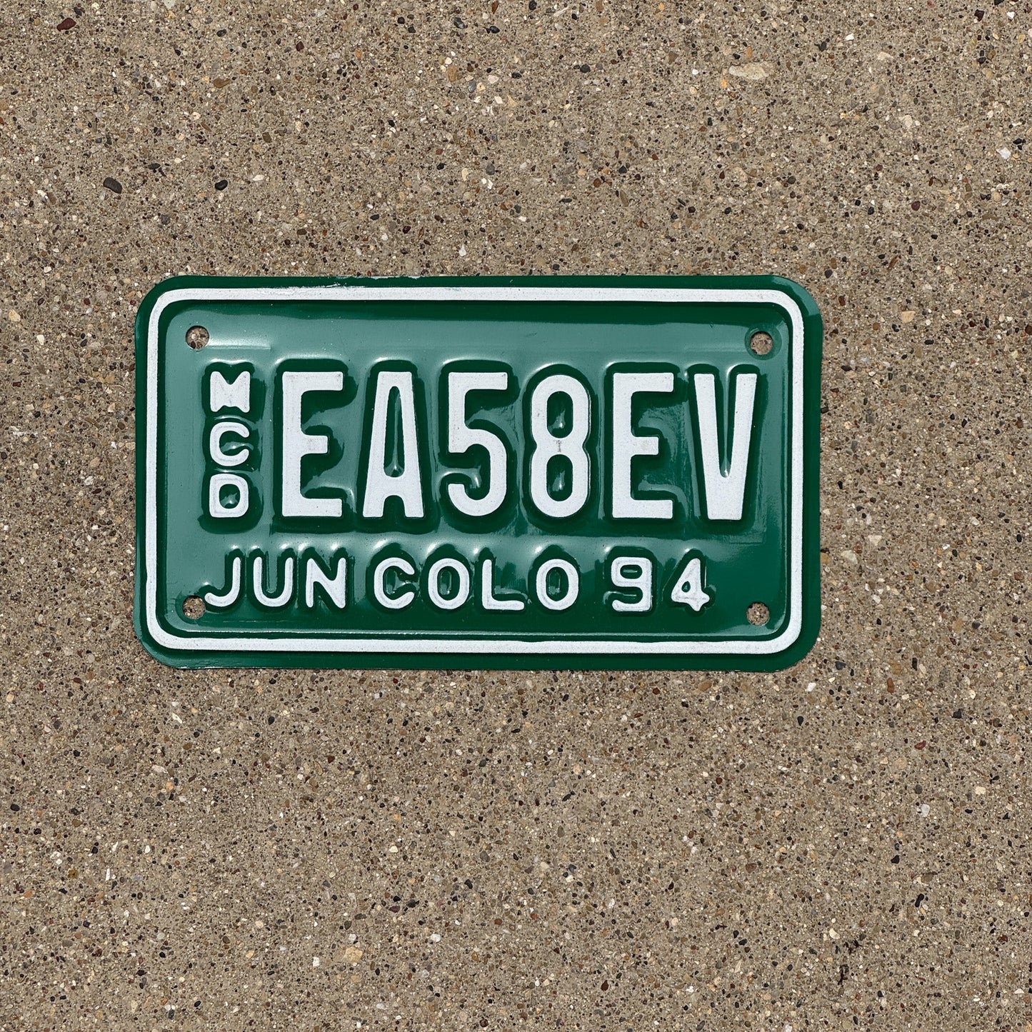 Photo of a 1994 Colorado Motorcycle Dealer License Plate Auto Tag Garage Decor Vintage EA 58 EV