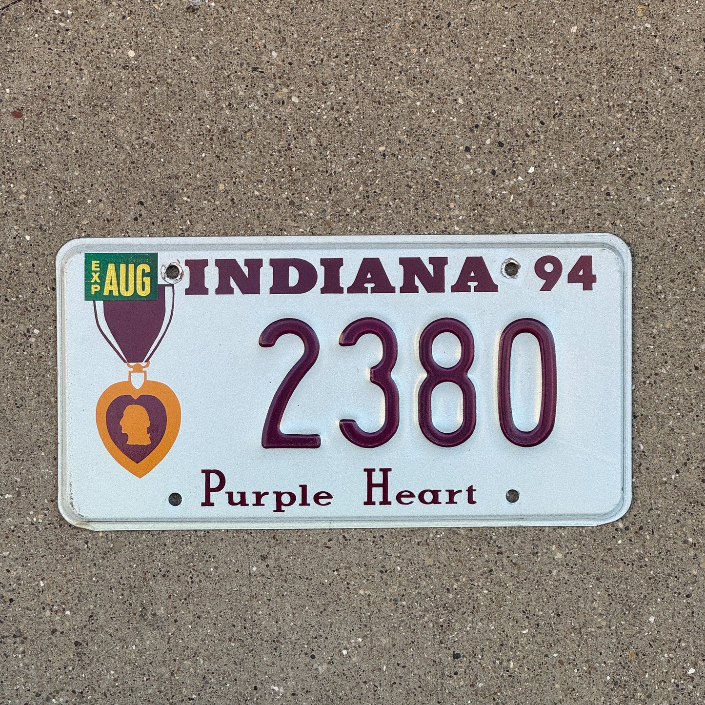 Photo of a 1994 Indiana Military License Plate Auto Tag Garage Decor Vintage Purple Heart 2380 with original patina