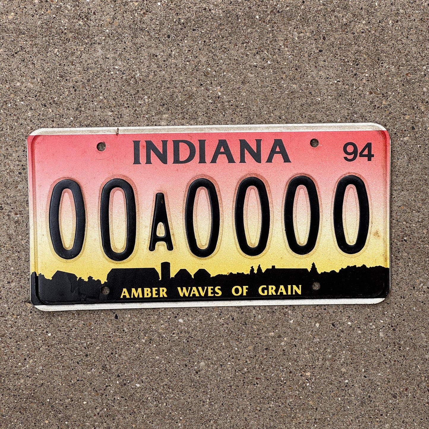 Photo of a 1994 Indiana SAMPLE License Plate Auto Tag Garage Decor Vintage Amber Waves 00A0000