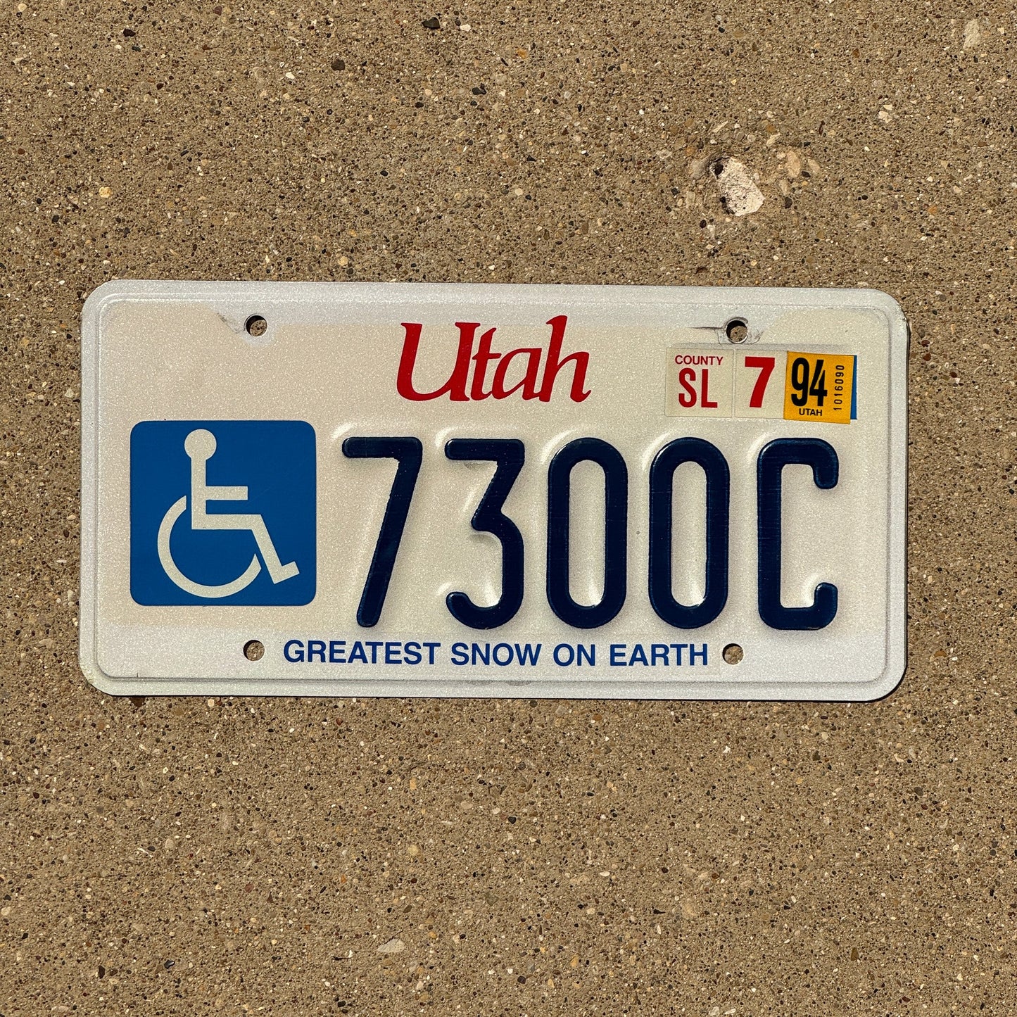 Photo of a 1994 Utah Handicap License Plate Auto Tag Garage Decor Vintage Natural 1994 7300 C