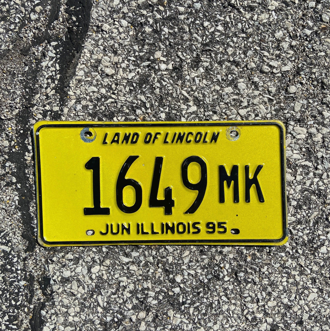 Photo of a 1995 Illinois Truck Mileage Tax License Plate Auto Tag 2 Garage Decor Low Number 1949 MK