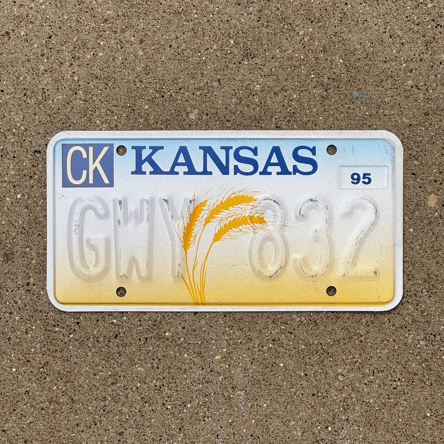 Photo of a 1995 Kansas Error License Plate Auto Tag Garage Decor Vintage Misprint GWY 832