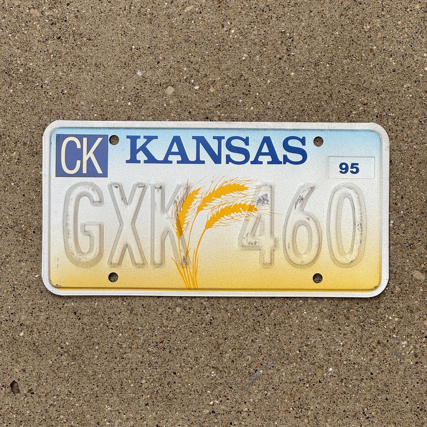 Photo of a 1995 Kansas Error License Plate Auto Tag Garage Decor Vintage Misprint GXK 460