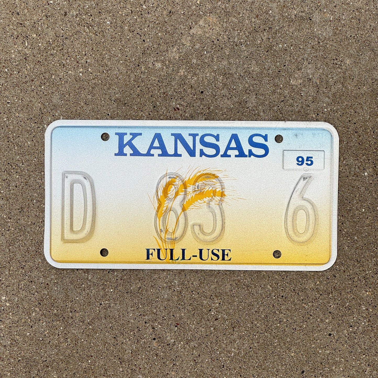 Photo of a 1995 Kansas Full Use Error License Plate Auto Tag Garage Decor Vintage Misprint D 83 6