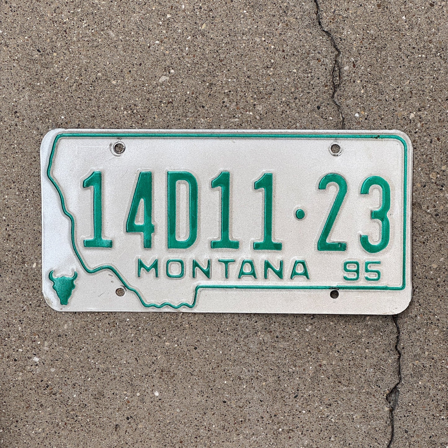 Photo of a 1995 Montana Dealer License Plate Auto Tag Garage Decor Vintage State Shape 14 D1123