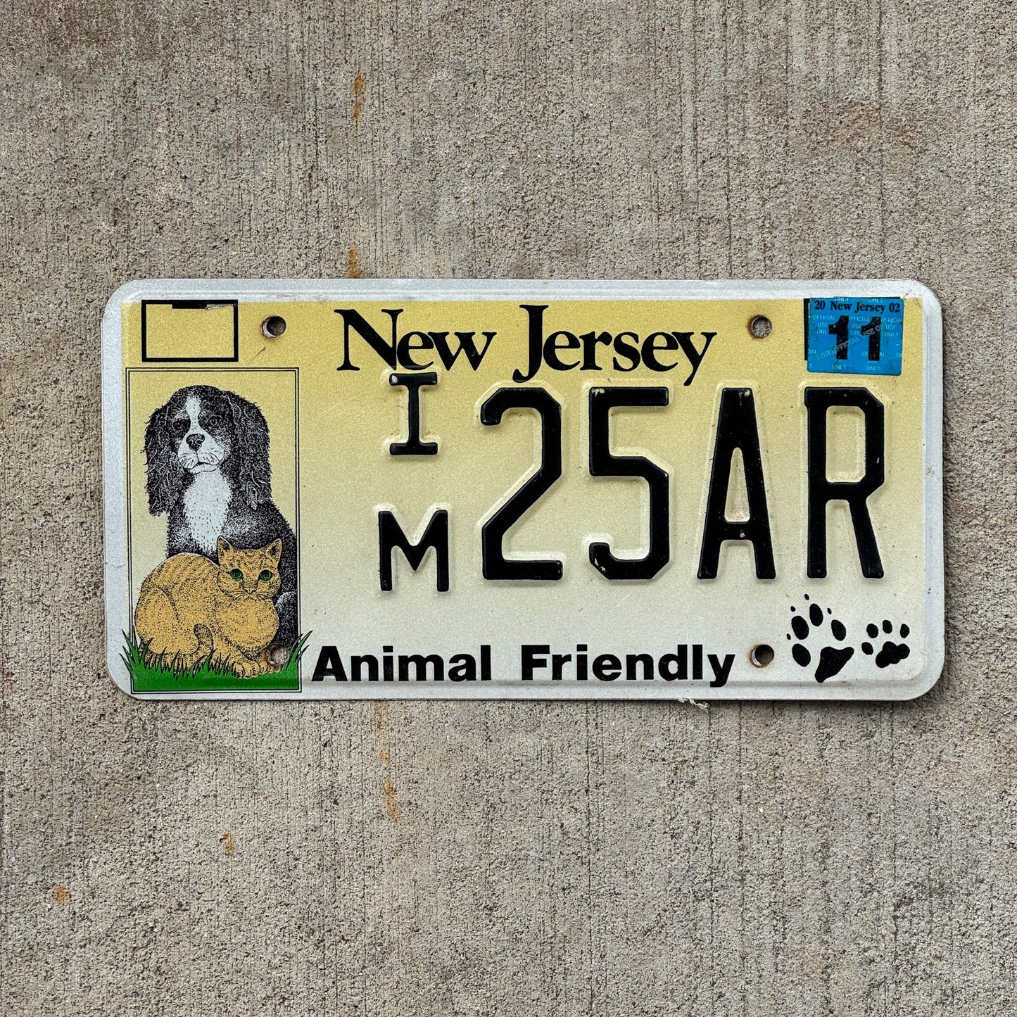 Photo of a 1995 New Jersey Graphic / Specialty License Plate Auto Tag Garage Decor Vintage Animal Friendly Pets IM 25 AR