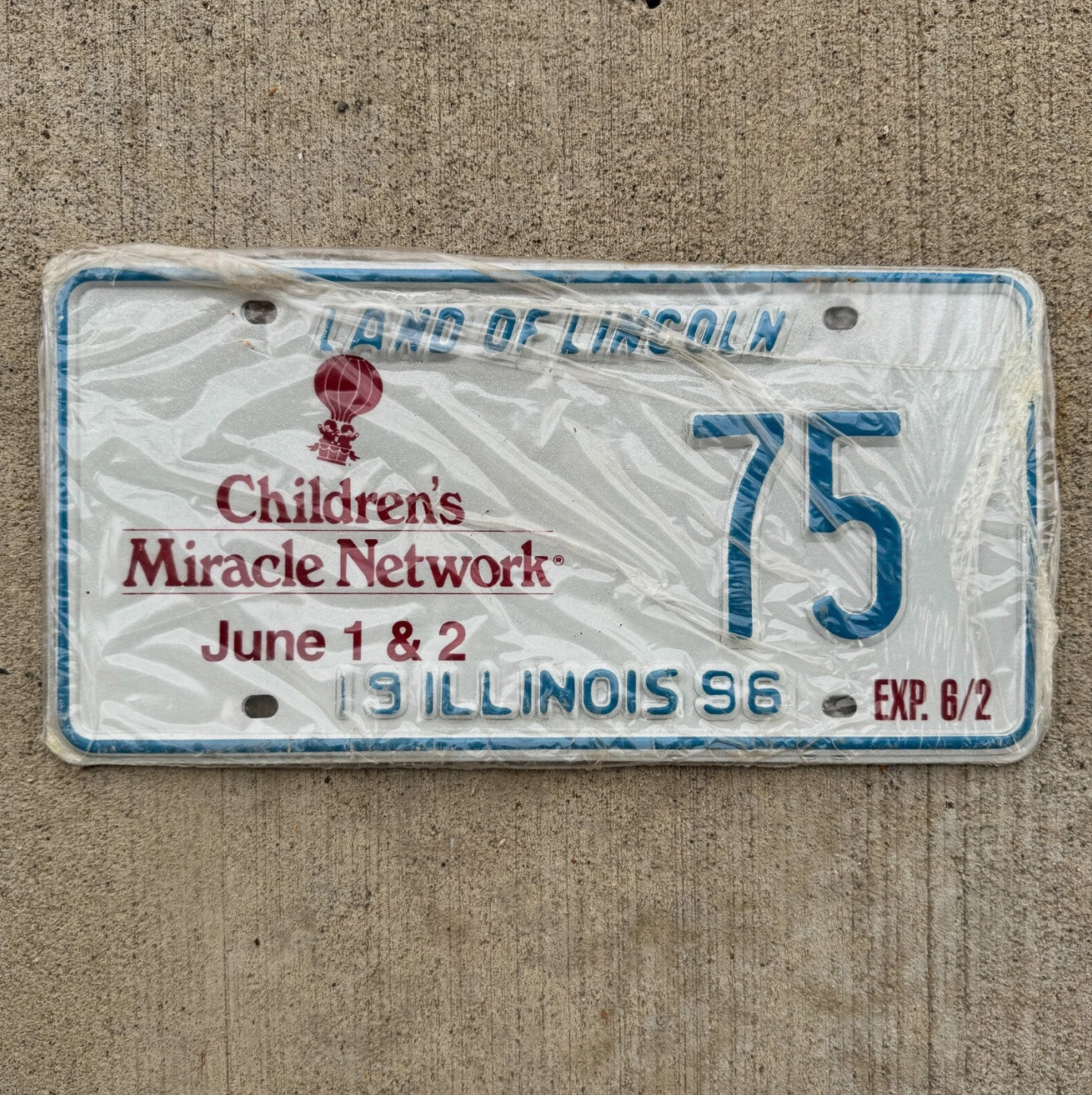 Photo of a 1996 Illinois Event License Plate Auto Tag Garage Children's Miracle Network 75