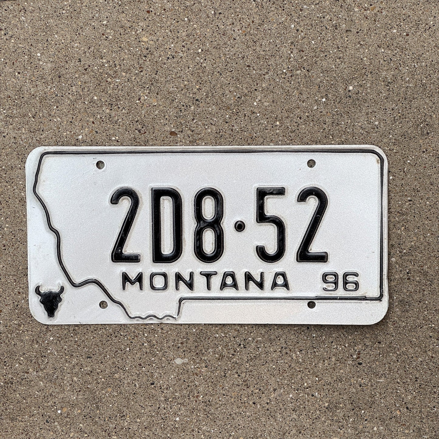 Photo of a 1996 Montana Dealer License Plate Auto Tag Garage Decor Vintage State Shape 2D 852