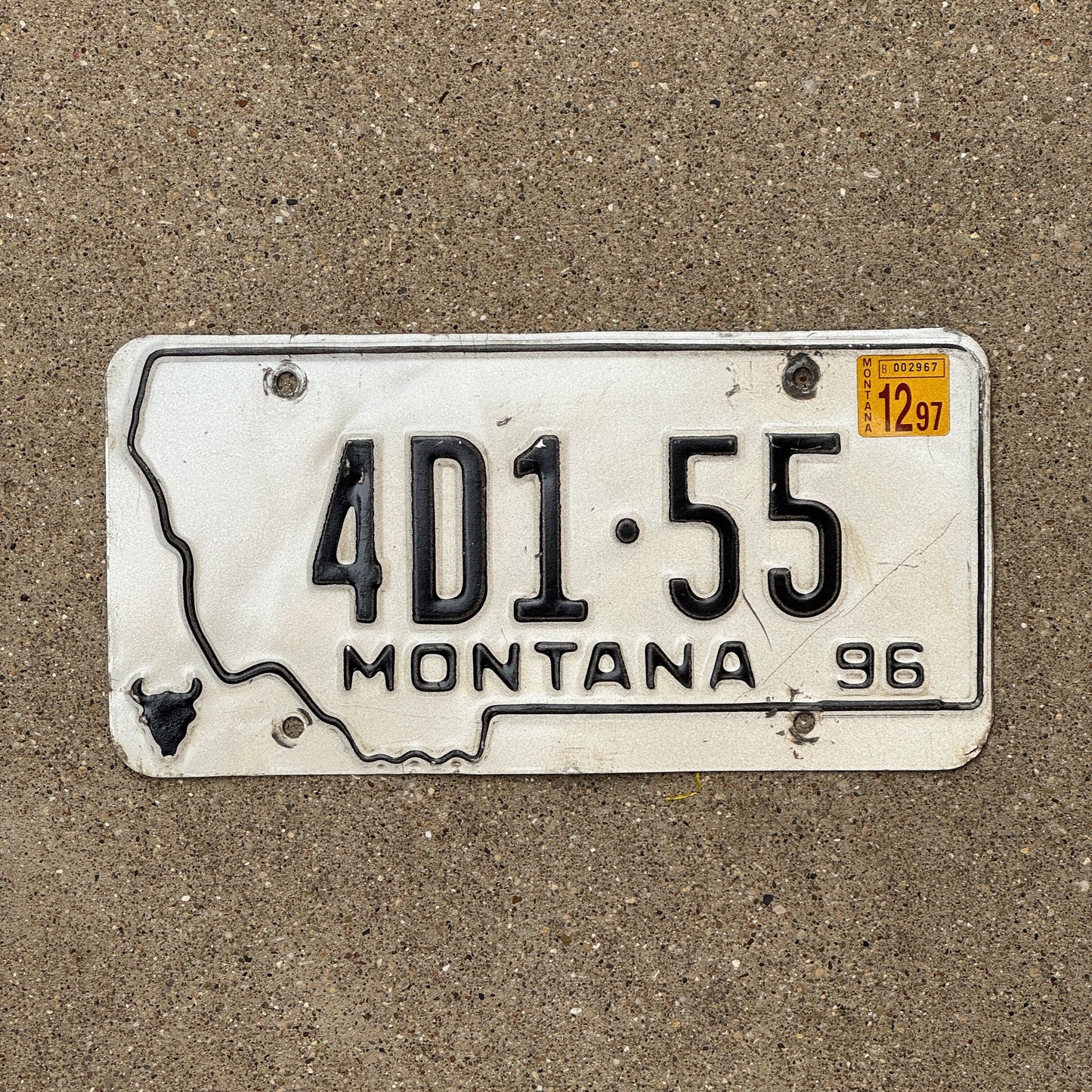 Photo of a 1996 Montana Dealer License Plate Auto Tag Garage Decor Vintage State Shape 4D 155