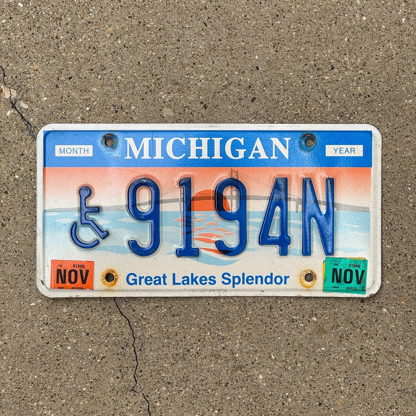 Photo of a 1997 2004 Michigan Handicapped License Plate Auto Tag Garage Decor Vintage Graphic / Specialty Great Lakes Splendor 9194 N