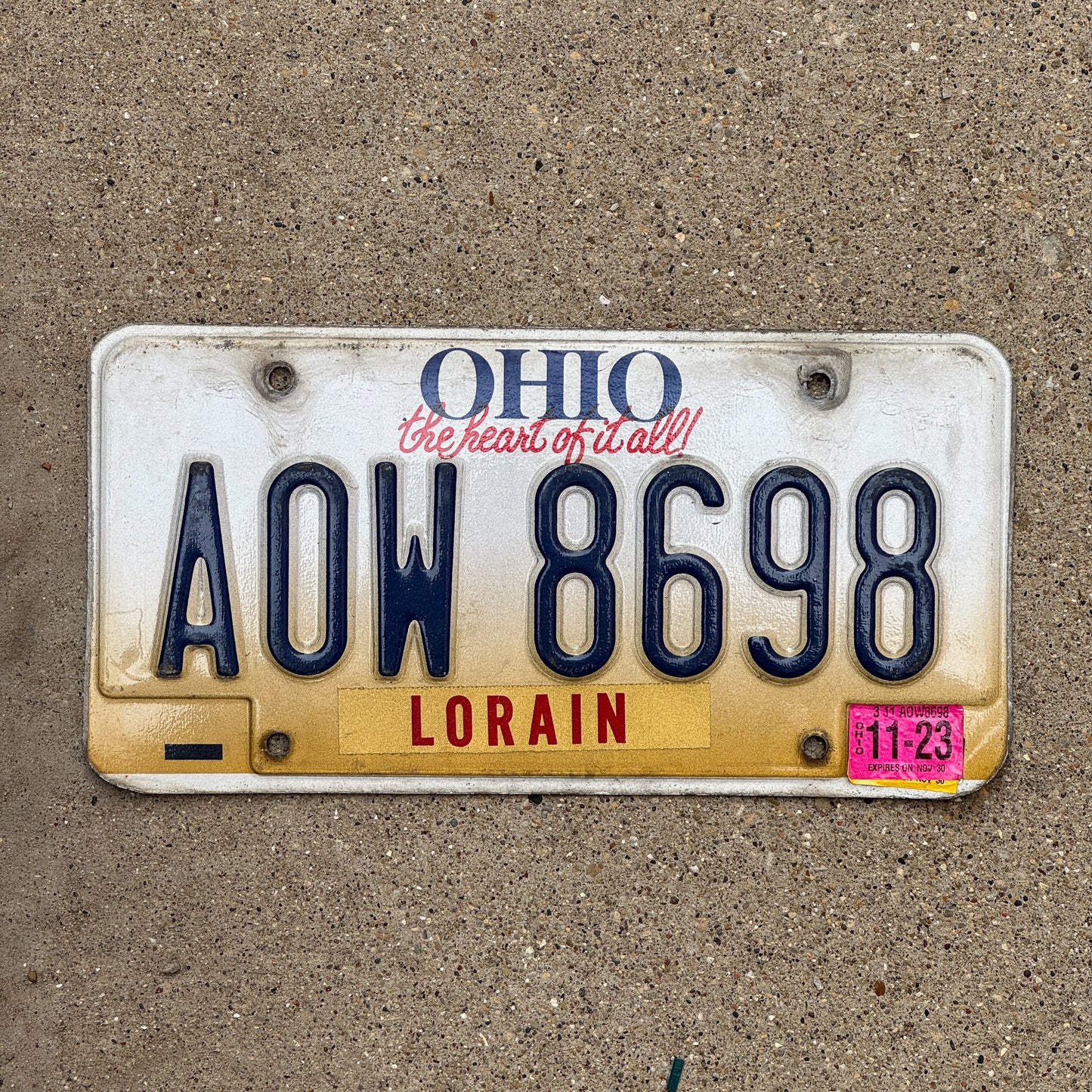 Photo of a 1997 2023 Ohio License Plate Auto Tag Garage Decor Vintage AOW 8698 with original patina