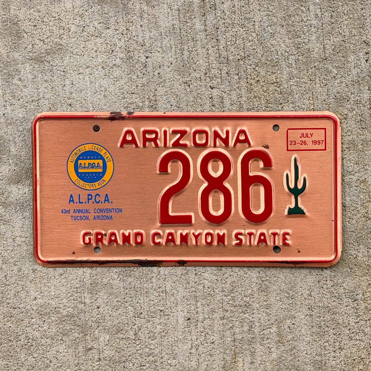 Photo of a 1997 Arizona ALPCA License Plate Auto Tag Garage Decor Vintage Tucson 43rd ALPCA Convention 286 with original patina
