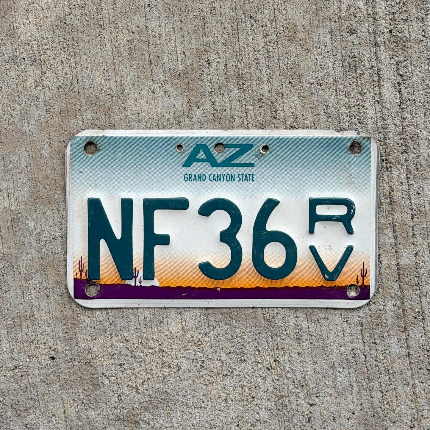Photo of a 1997 Arizona Off Road Vehicle License Plate Auto Tag Garage Decor Vintage NF 36 RV with original patina