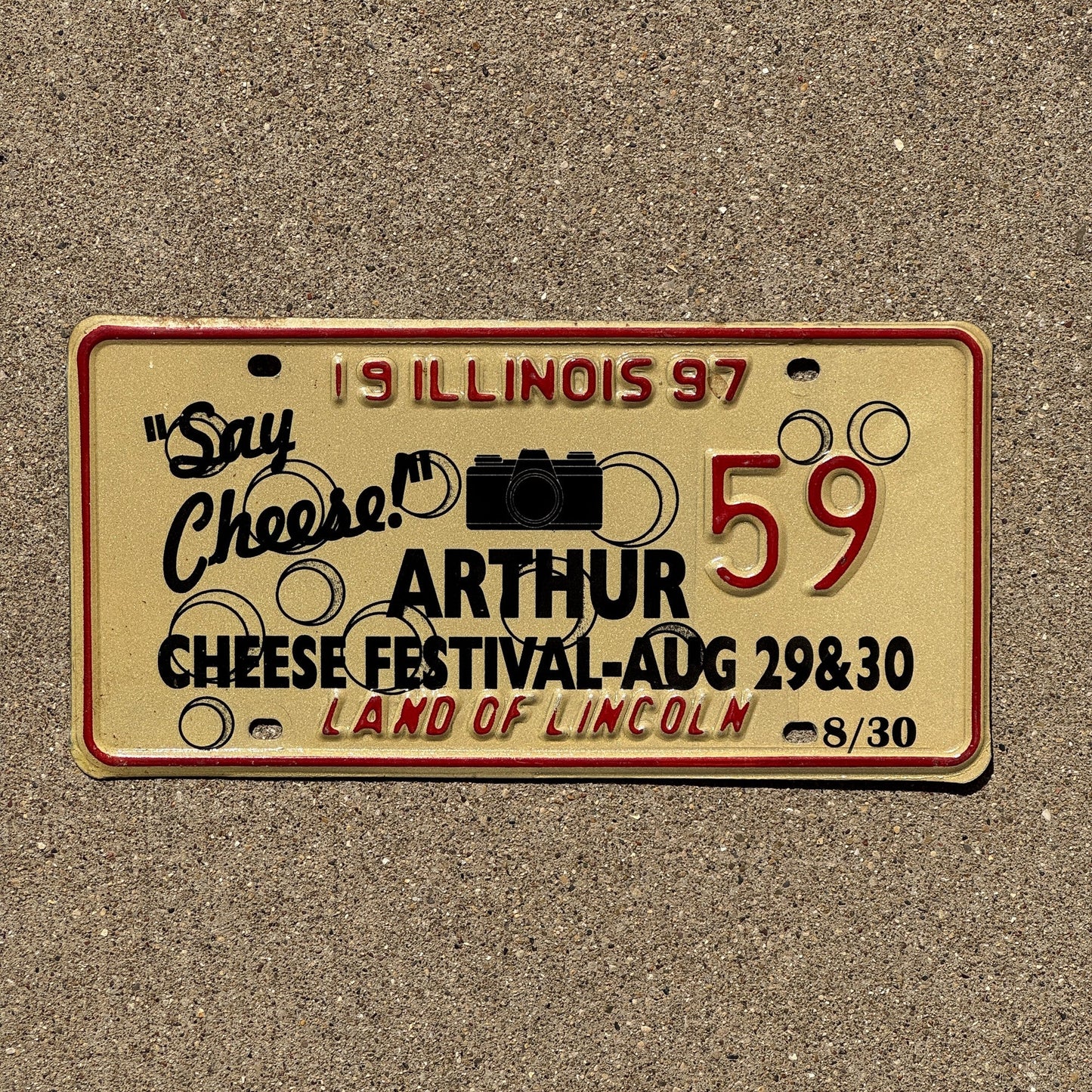 Photo of a 1997 Illinois EVENT License Plate Auto Tag 1 Garage Decor Vintage Say Cheese Festival Camera Arthur 59
