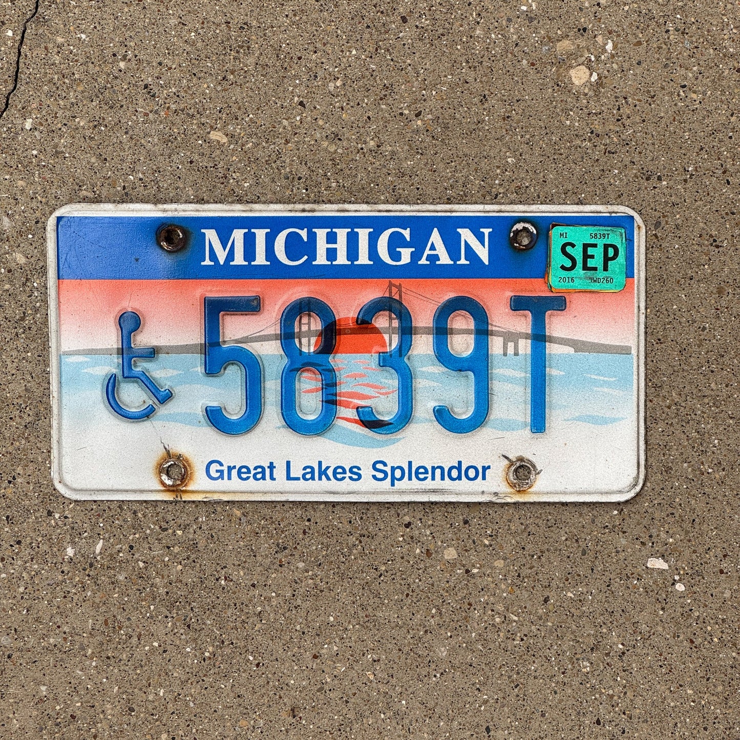 Photo of a 1997 Michigan Handicapped License Plate Auto Tag Garage Decor Vintage Graphic / Specialty Great Lakes Splendor 5839 T