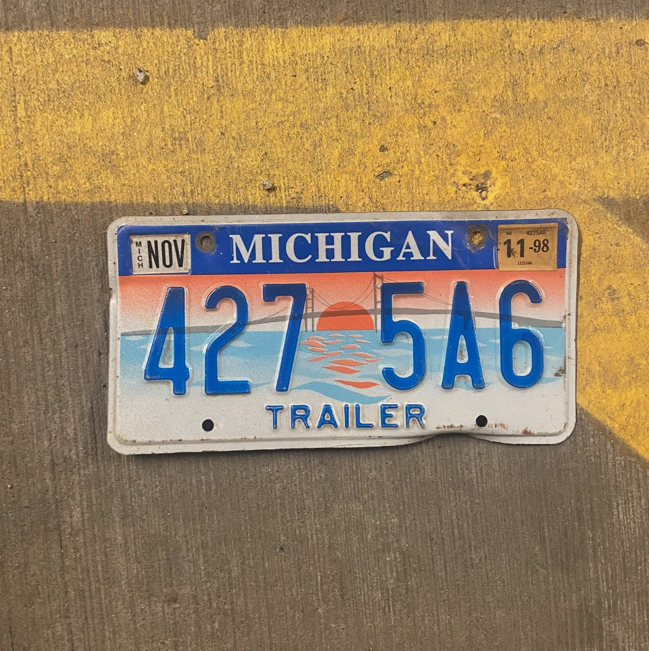Photo of a 1997 Michigan Trailer License Plate Auto Tag Garage Decor Vintage 427 5A6