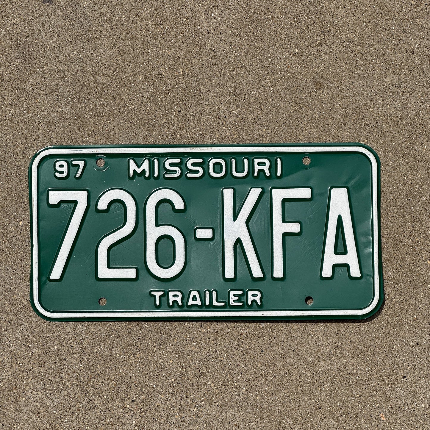 Photo of a 1997 Missouri Trailer License Plate Auto Tag Garage Decor Vintage 726 KFA