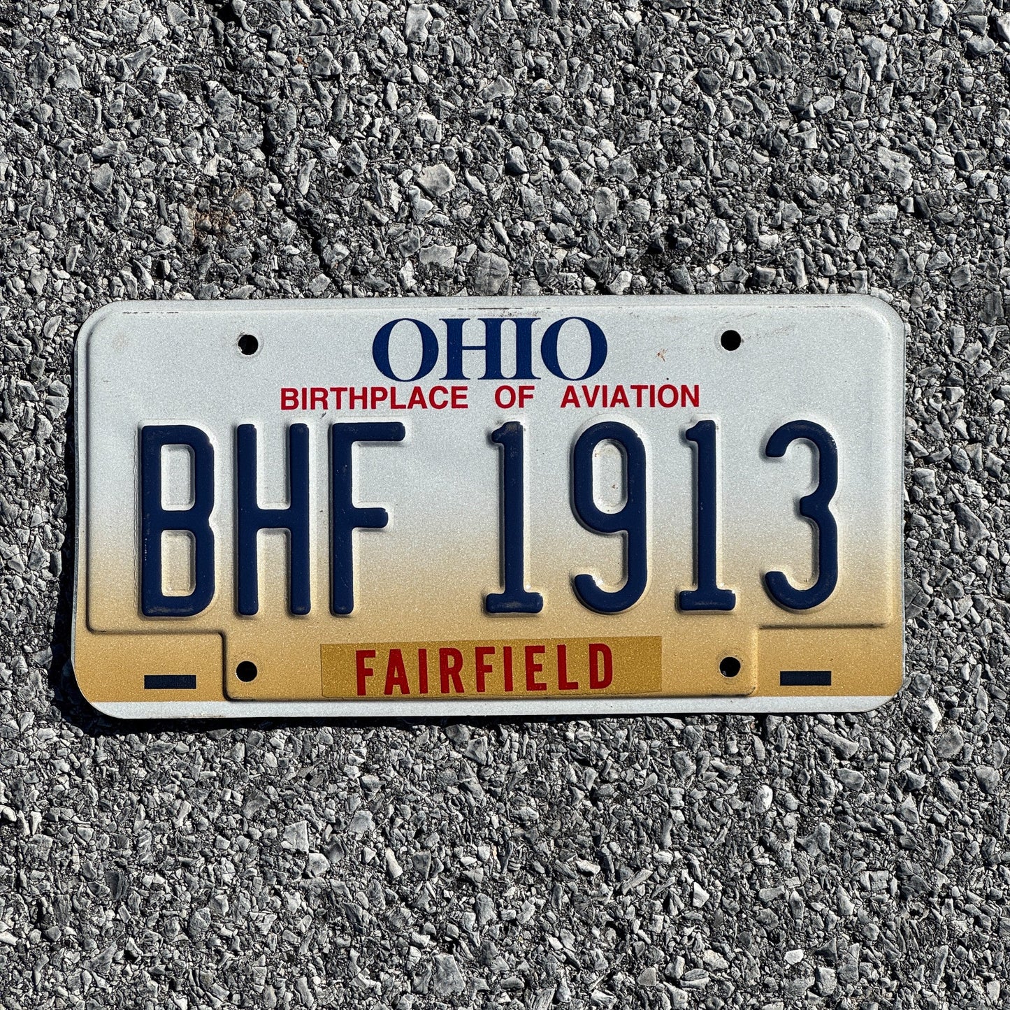 Photo of a 1997 Ohio License Plate Auto Tag 2 Garage Decor BHF 1913