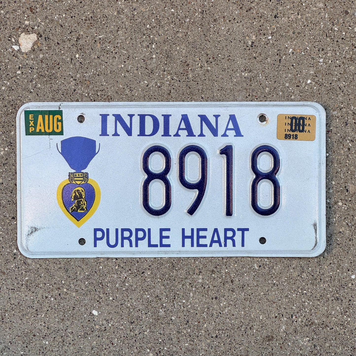 Photo of a 1998 2000 Indiana Military License Plate Auto Tag Garage Decor Vintage Purple Heart 8918 with original patina